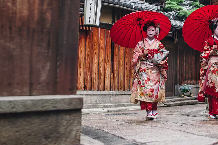 japan two geishas umbrellas
