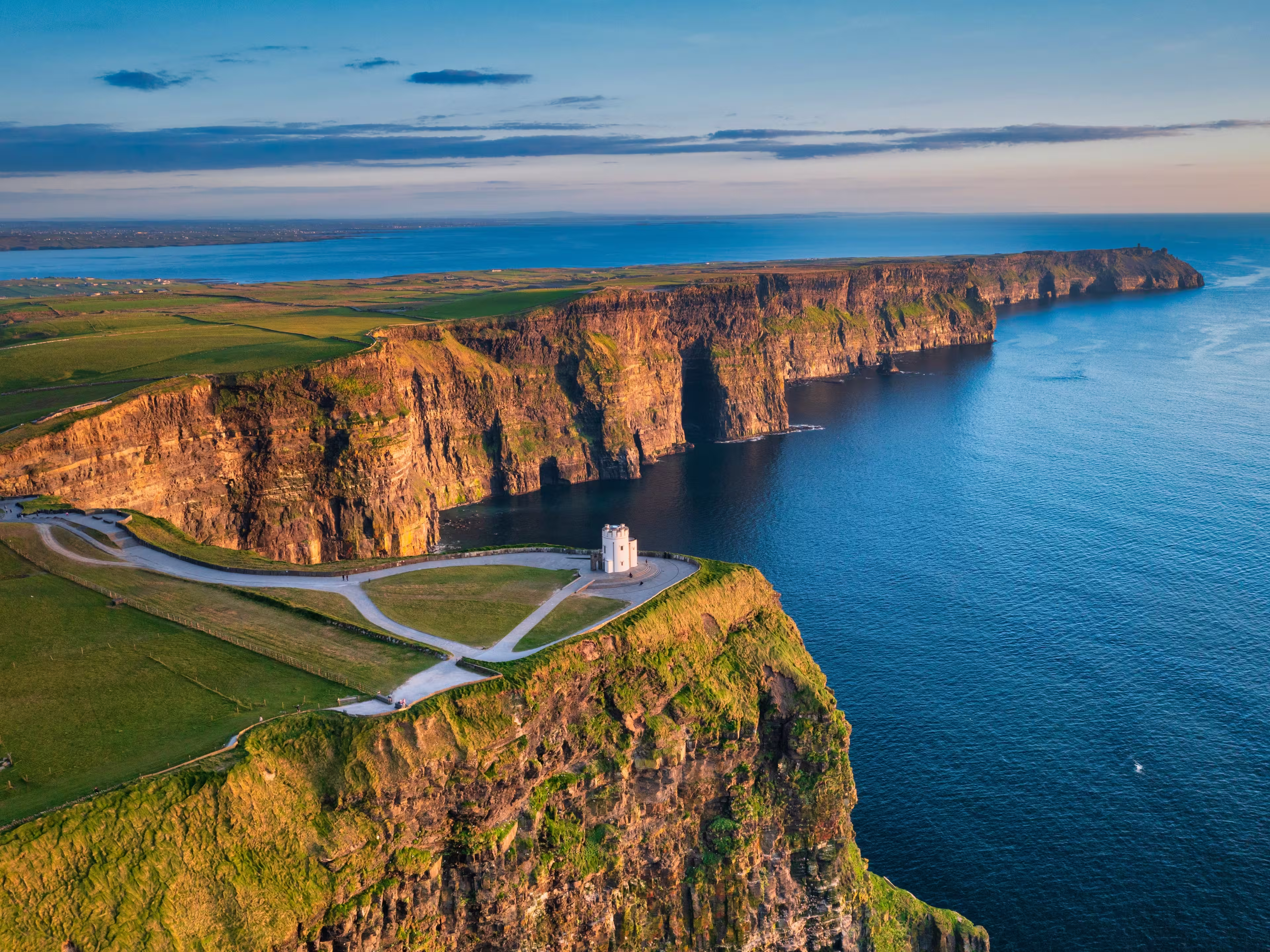 Aerial landscape with the Cliffs of Moher in County Clare at sunset, Ireland.