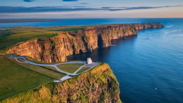 Aerial landscape with the Cliffs of Moher in County Clare at sunset, Ireland.