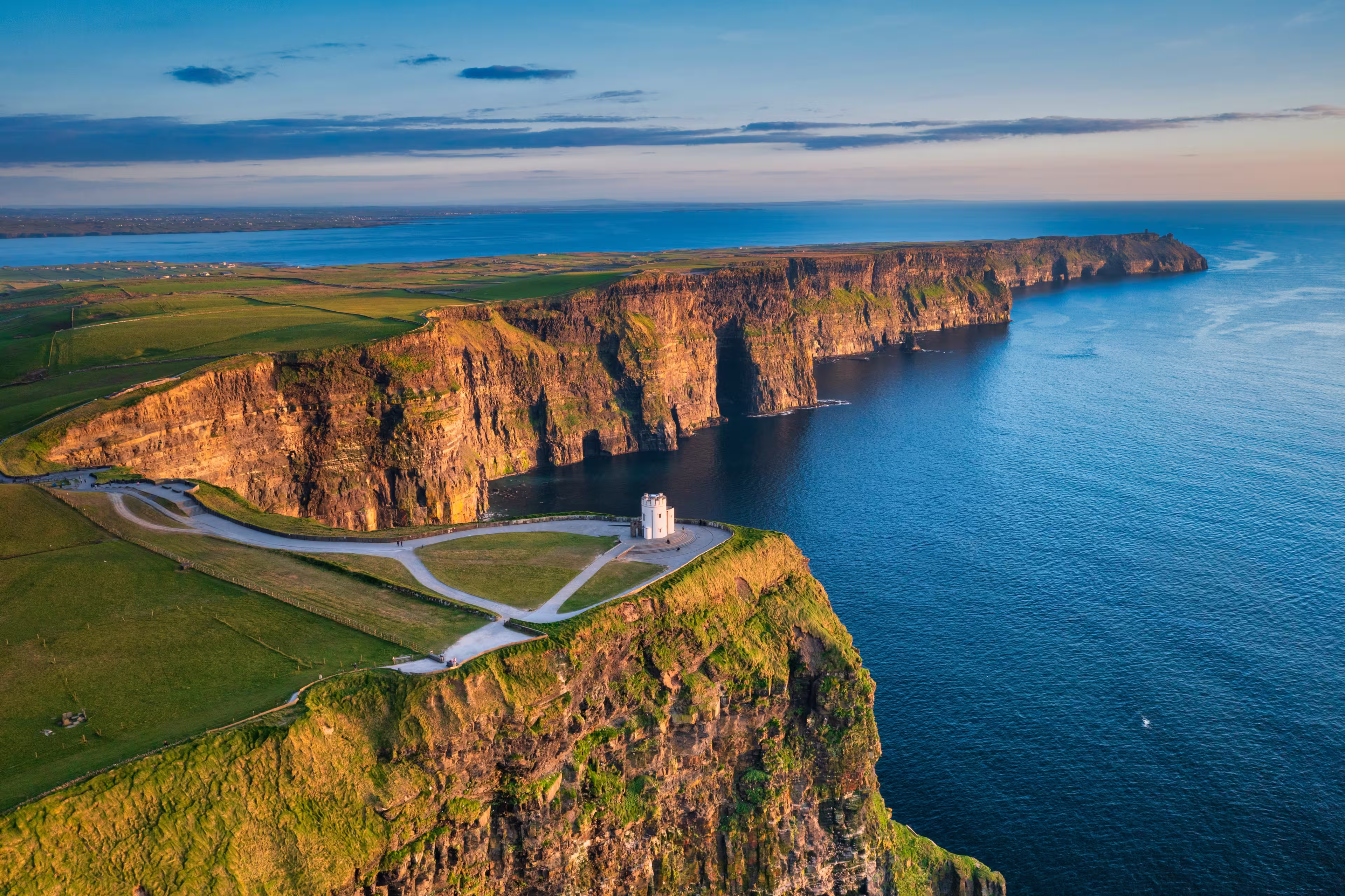 Aerial landscape with the Cliffs of Moher in County Clare at sunset, Ireland.
