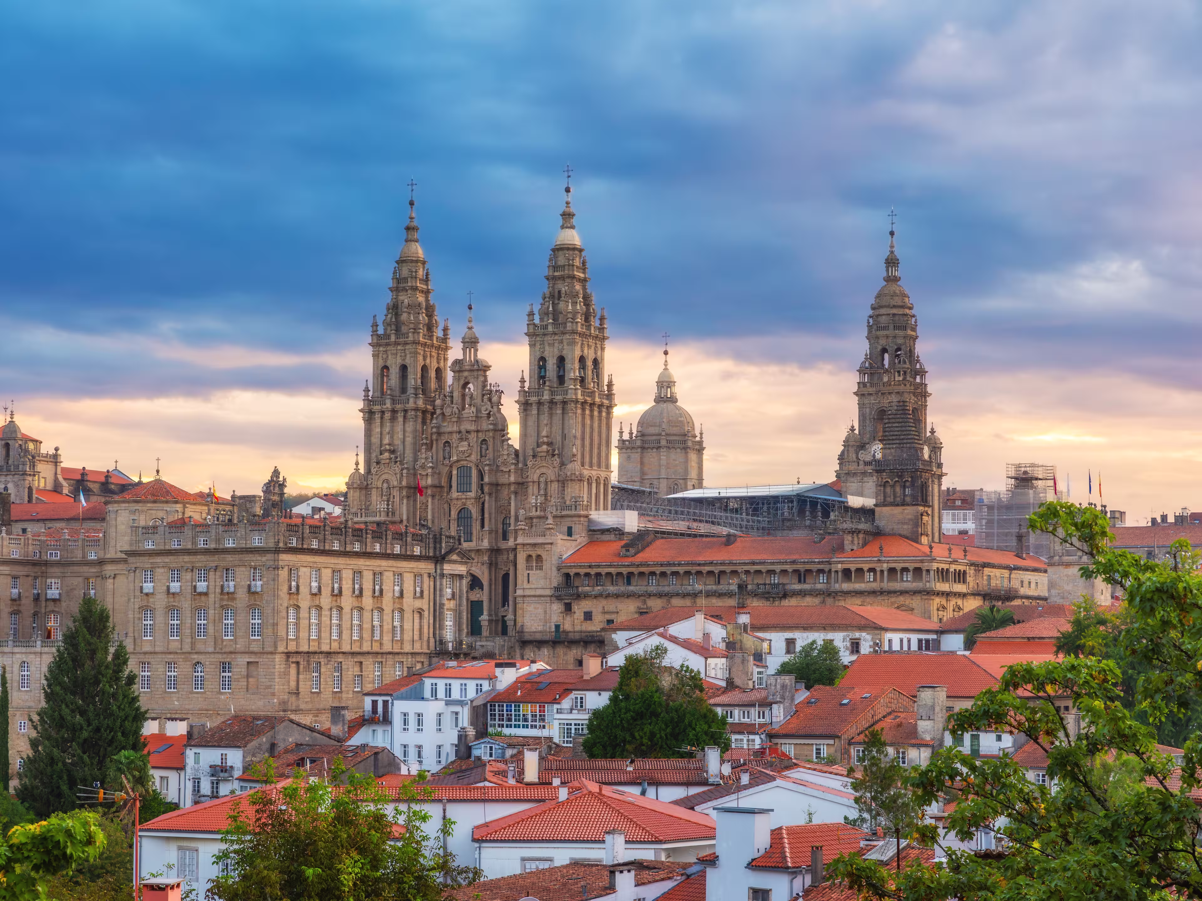 Aerial view of Santiago de Compostela city with Cathedral and buildings at sunrise, Galicia, Spain. Galician gothic church. Popular touristic landmark