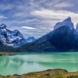 The turquoise waters of Lake Nordenskjöld, set against the dramatic backdrop of Los Cuernos del Paine in Torres del Paine National Park, Patagonia, Chile