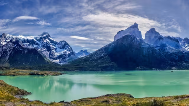 The turquoise waters of Lake Nordenskjöld, set against the dramatic backdrop of Los Cuernos del Paine in Torres del Paine National Park, Patagonia, Chile