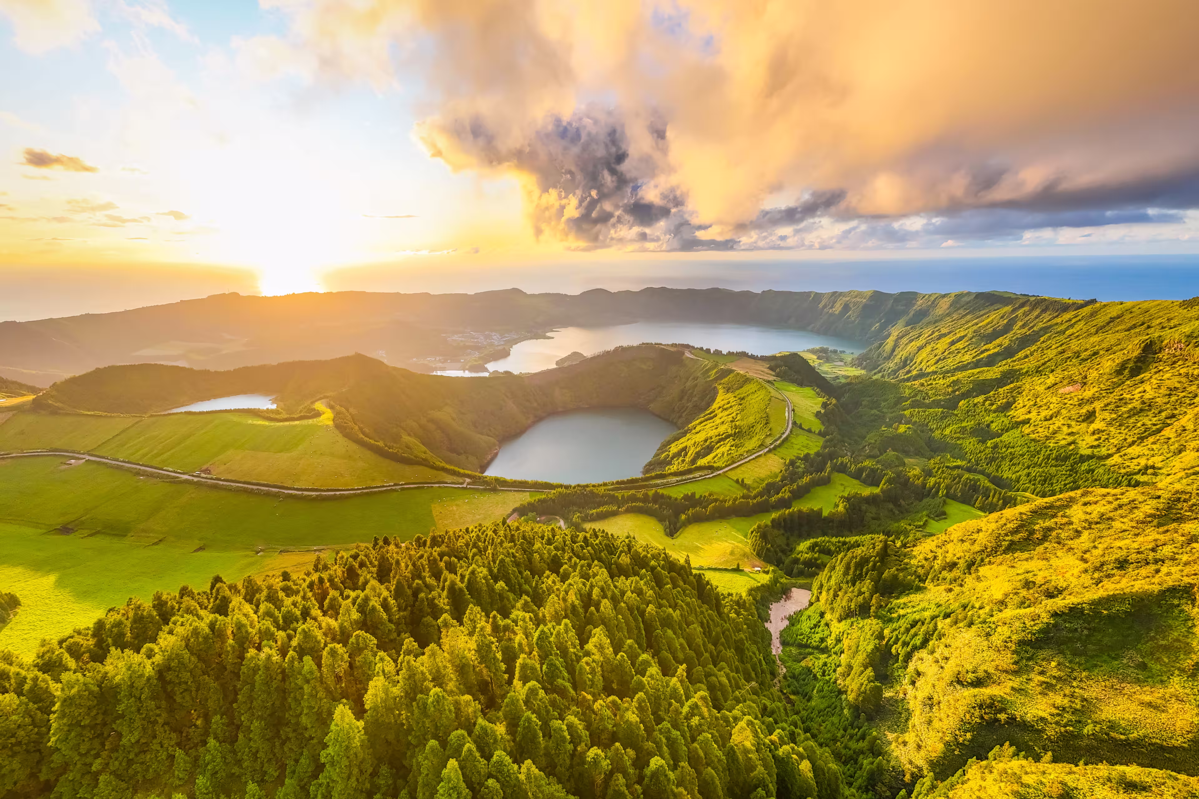 Panorama of Sete Cidades Caldera at Sunset. Blue Lake, Lake Rasa and Santiago Lake. Forest and Hills with Pasturelands. Azores, Sao Miguel Island. Portugal. Aerial Panoramic Shot