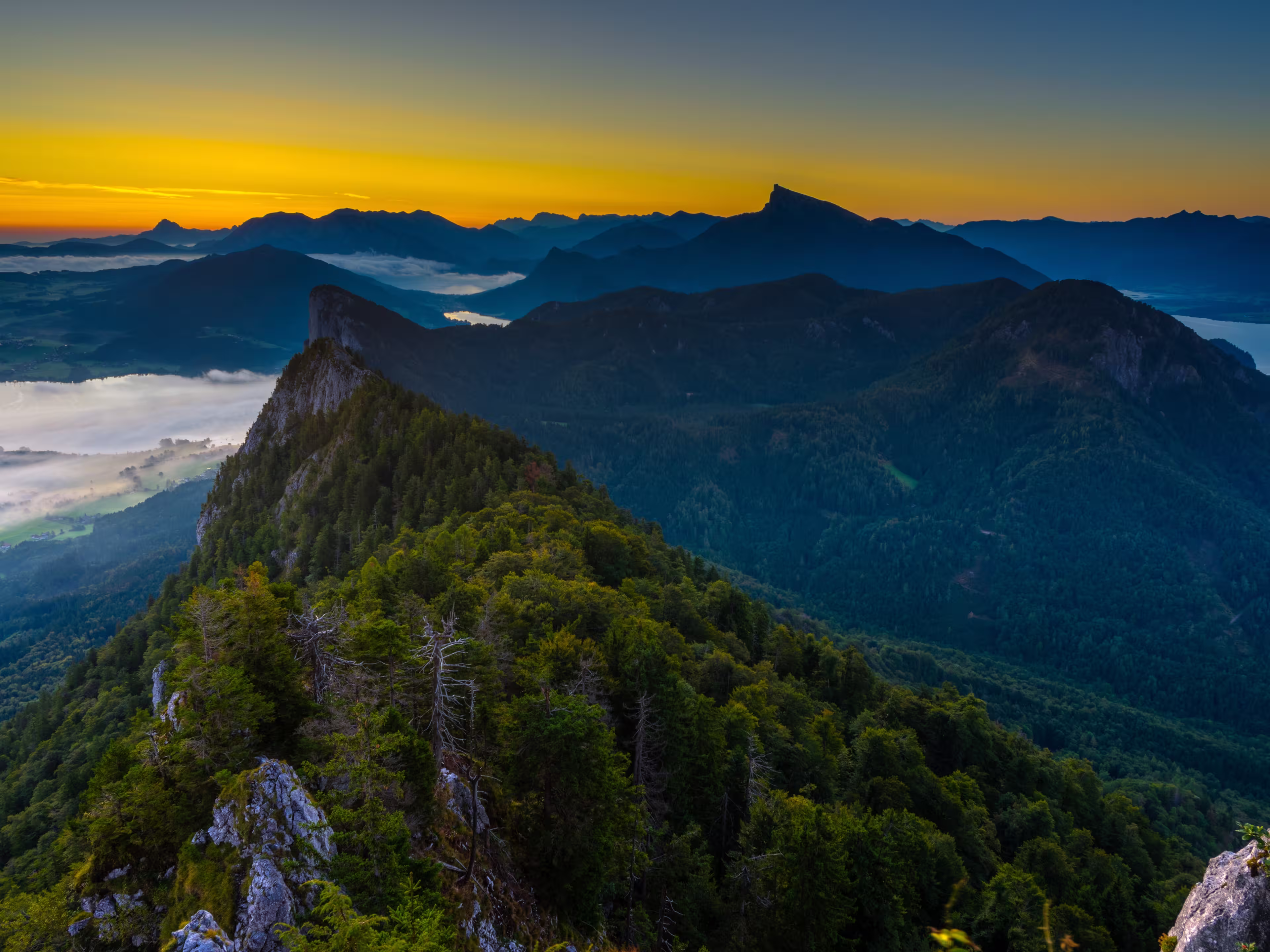 Foggy sunrise over Salzkammergut mountains
