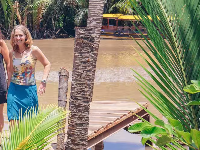Travellers get ready to board boat on the mekong