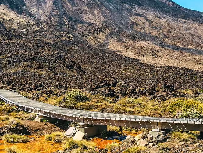 Travellers about to ascend the trail up Tongariro Crossing, North Island, New Zealand
