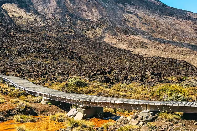 Travellers about to ascend the trail up Tongariro Crossing, North Island, New Zealand