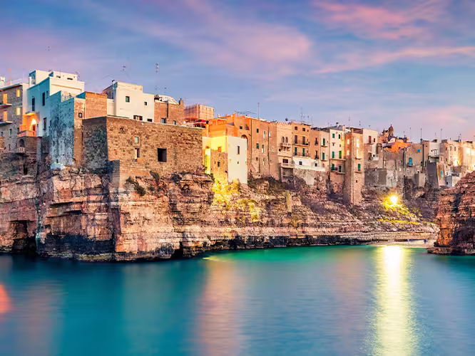 Panoramic evening cityscape of Polignano a Mare town, Puglia region, Italy, Europe.