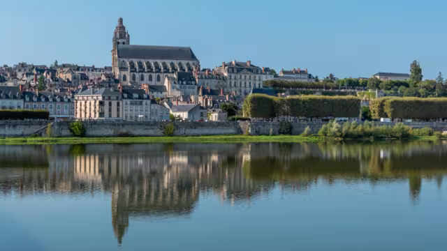 Panoramic view on Blois city and Cathedral of St. Louis , reflection on Loire river, France, wide format