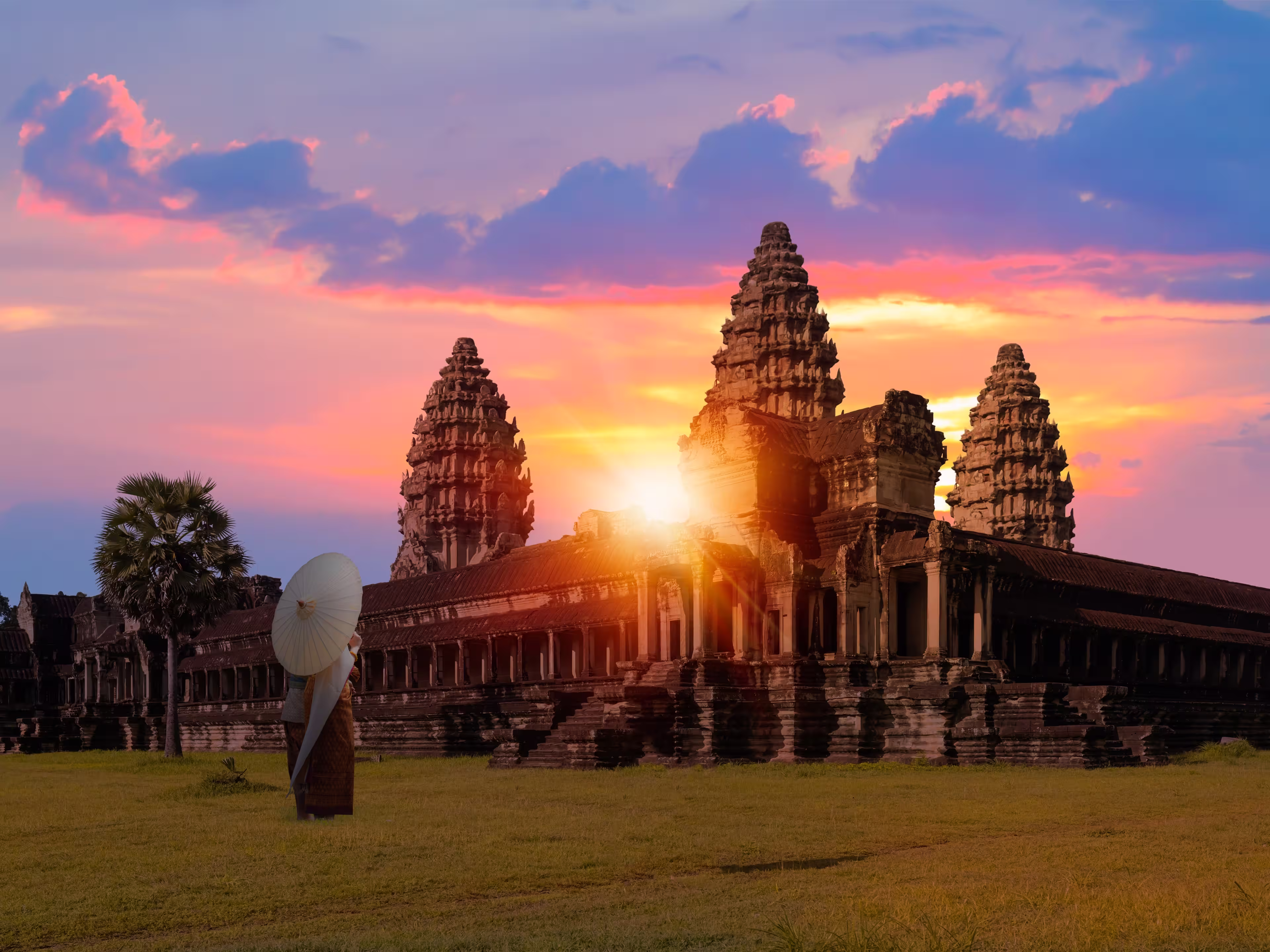 Unidentified young couple green traditional ceremonial wedding Khmer clothing at the ancient Angkor Wat temple - Cambodia