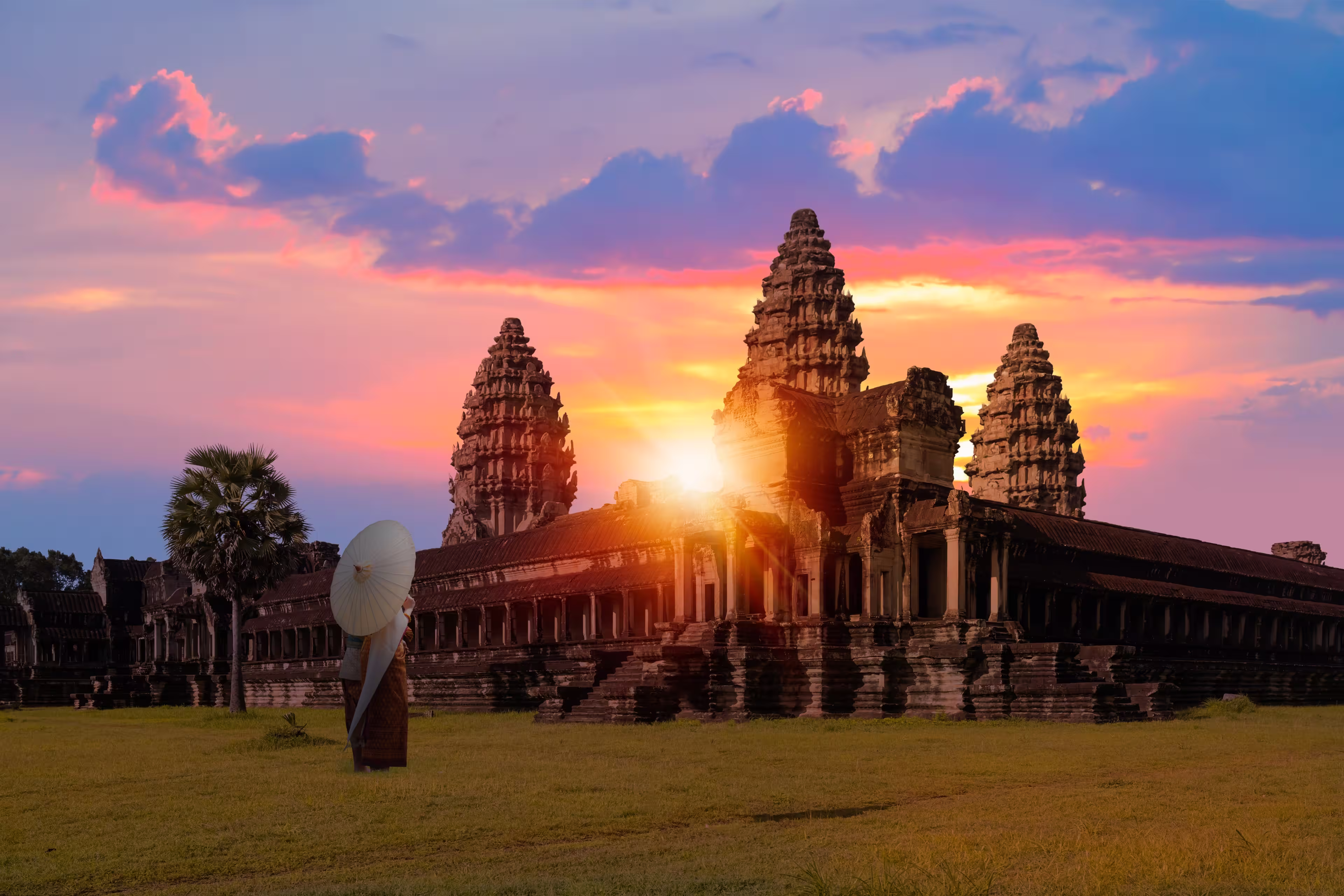 Unidentified young couple green traditional ceremonial wedding Khmer clothing at the ancient Angkor Wat temple - Cambodia