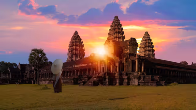 Unidentified young couple green traditional ceremonial wedding Khmer clothing at the ancient Angkor Wat temple - Cambodia