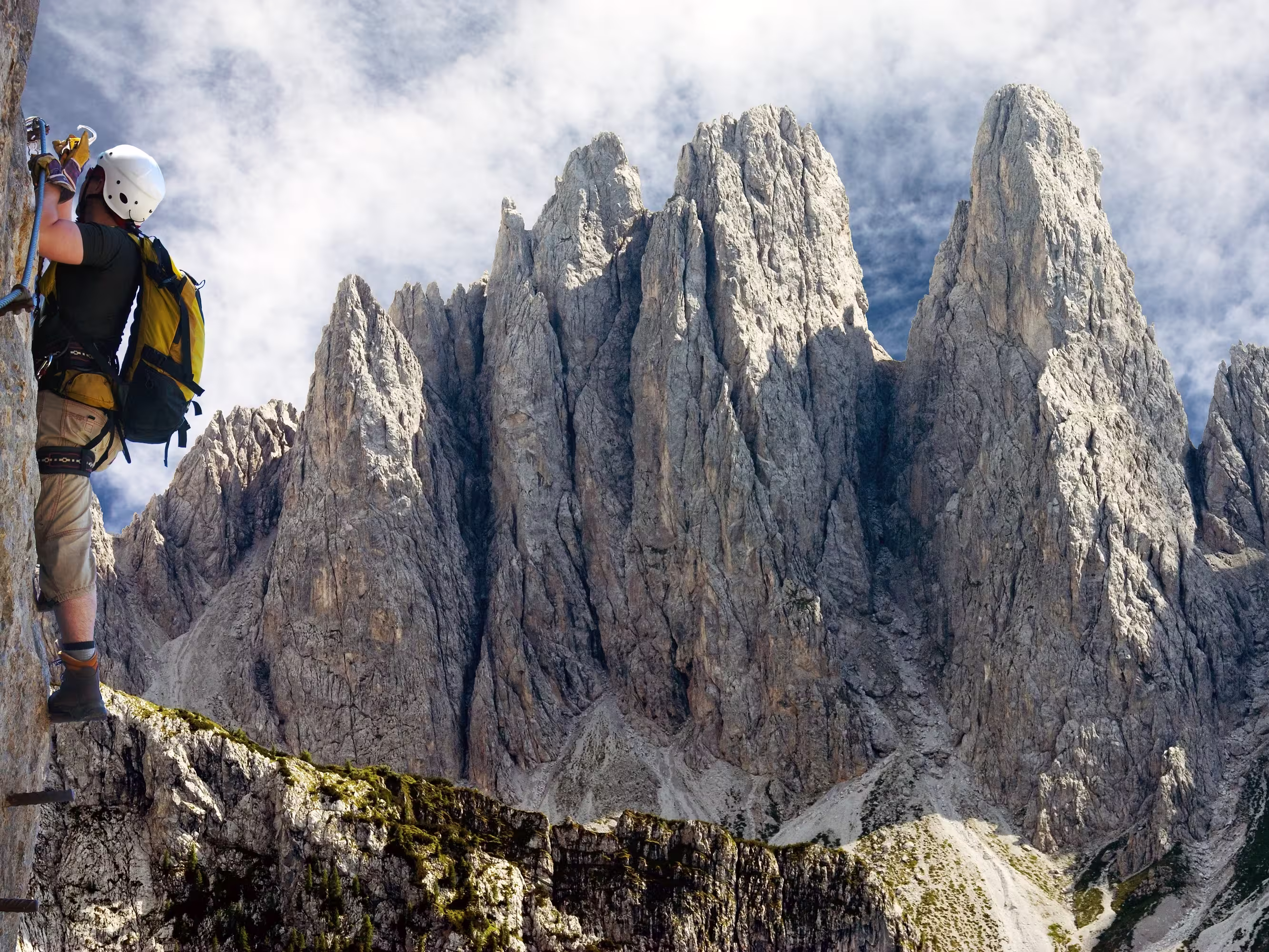 climber on via ferrata or klettersteig in Italy or Austria dolomit - Dolomiti di Sesto or Sextener Dolomiten