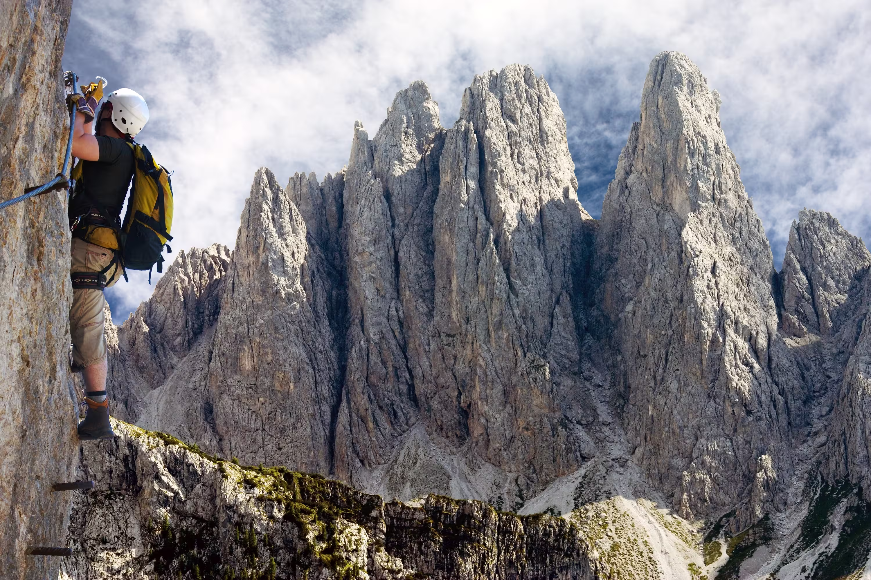 climber on via ferrata or klettersteig in Italy or Austria dolomit - Dolomiti di Sesto or Sextener Dolomiten