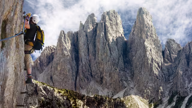 climber on via ferrata or klettersteig in Italy or Austria dolomit - Dolomiti di Sesto or Sextener Dolomiten
