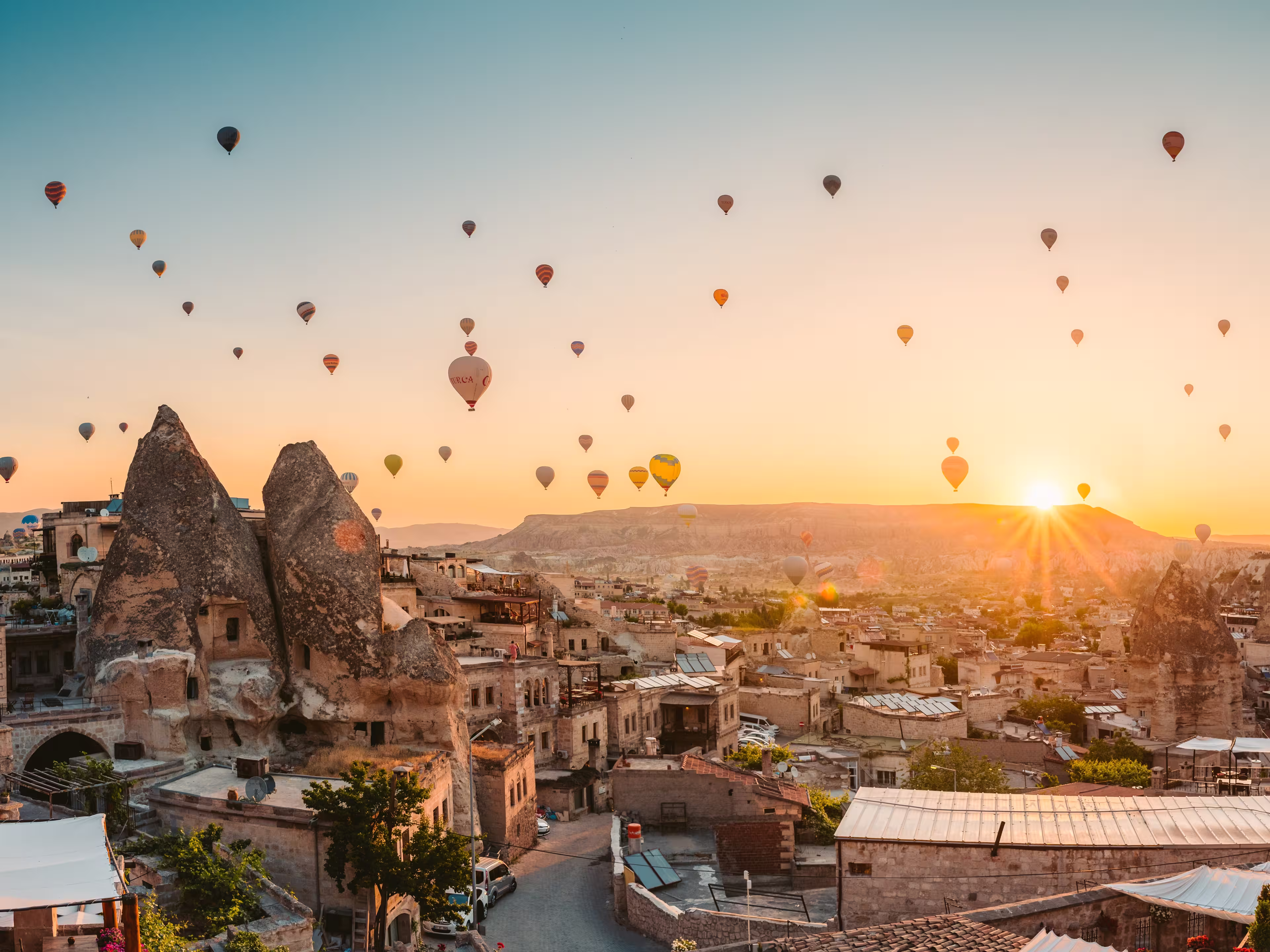 balloons at fairy chimneys at sunrise in Göreme, Cappadocia