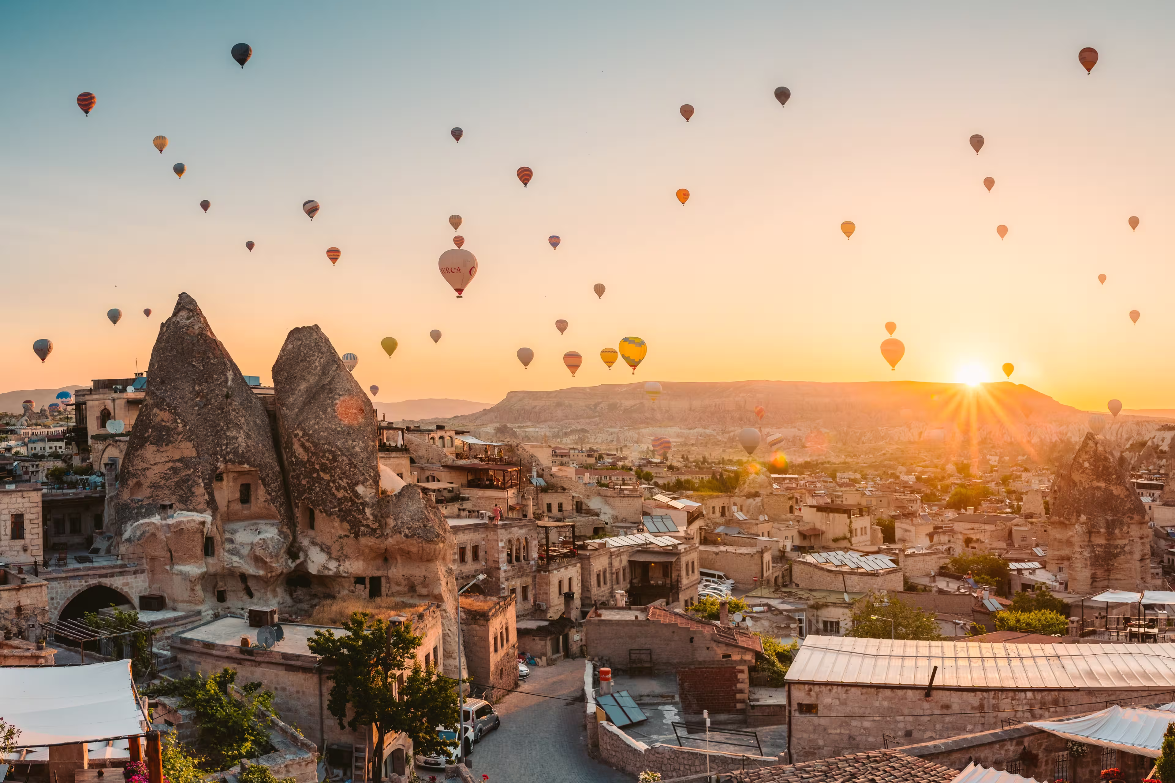 balloons at fairy chimneys at sunrise in Göreme, Cappadocia