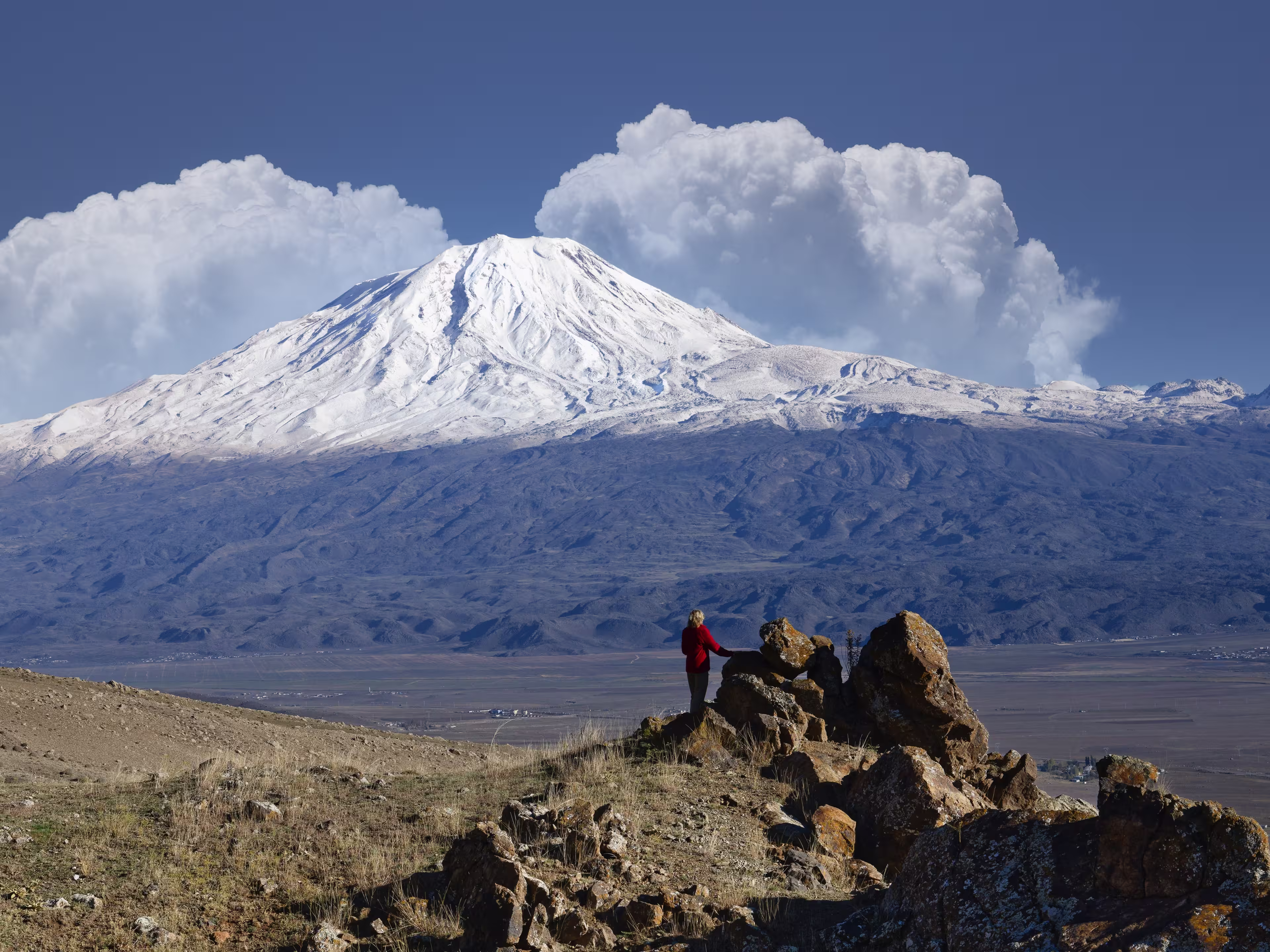 Woman looking to snowcapped Mount Ararat, Dogubayazit, Turkey