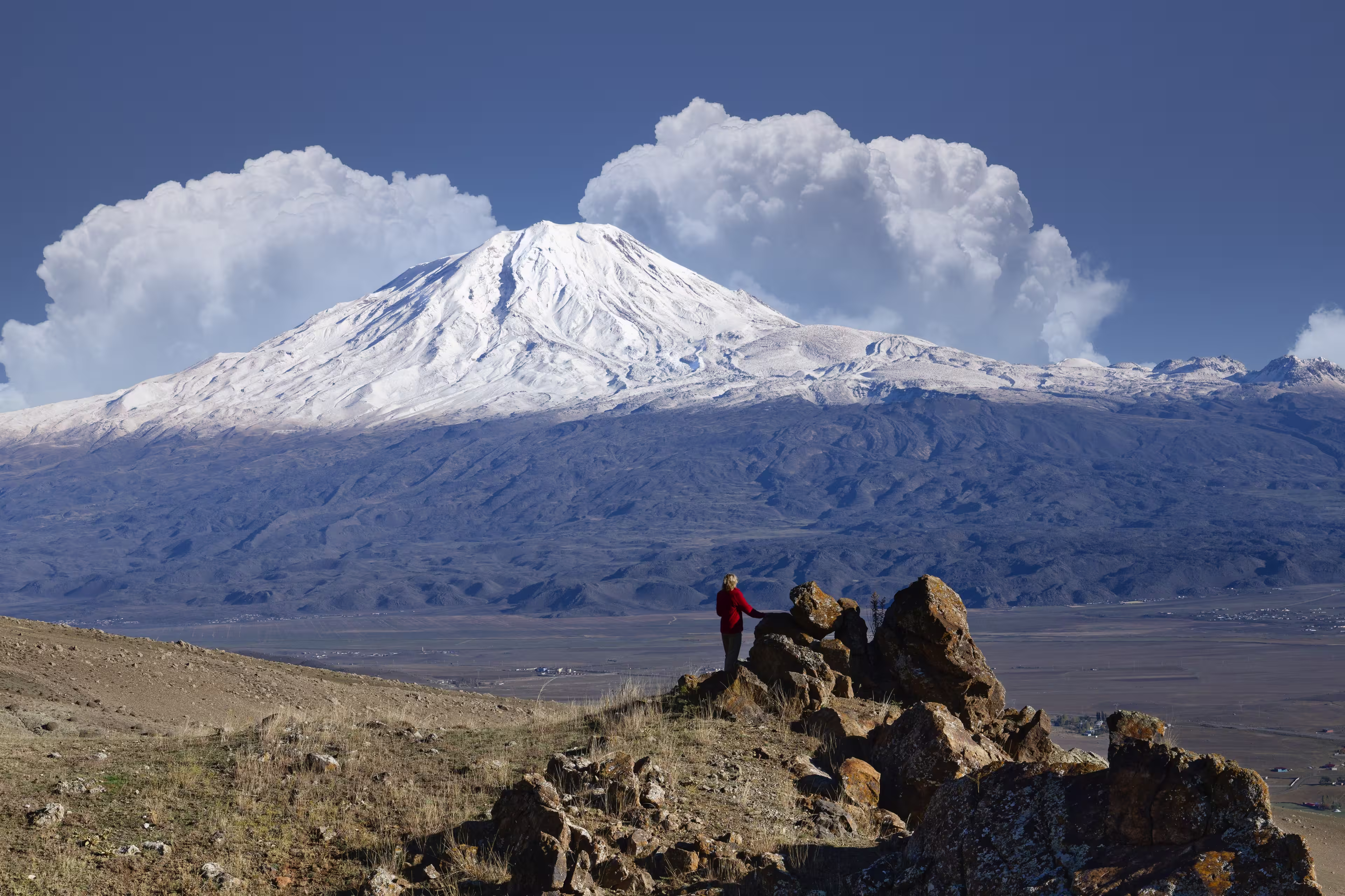 Woman looking to snowcapped Mount Ararat, Dogubayazit, Turkey