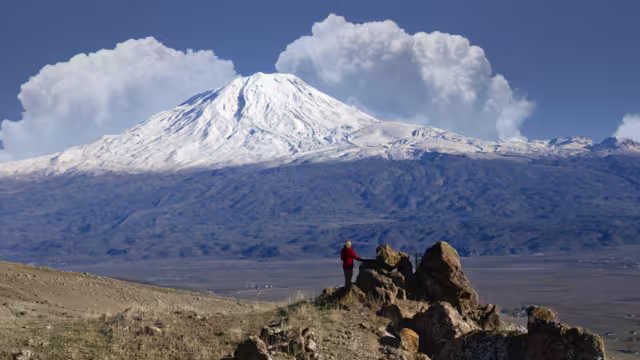 Woman looking to snowcapped Mount Ararat, Dogubayazit, Turkey