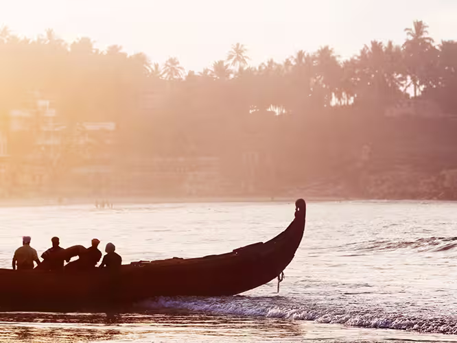 india kerala boats beach sunset silhouettes