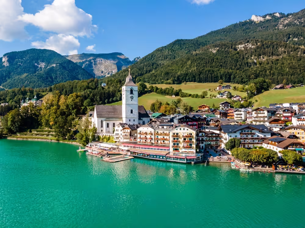 Idyllic View of St. Wolfgang Chapel and Village Waterfront. Explore the Serene Beauty of Wolfgangsee Lake in Austria