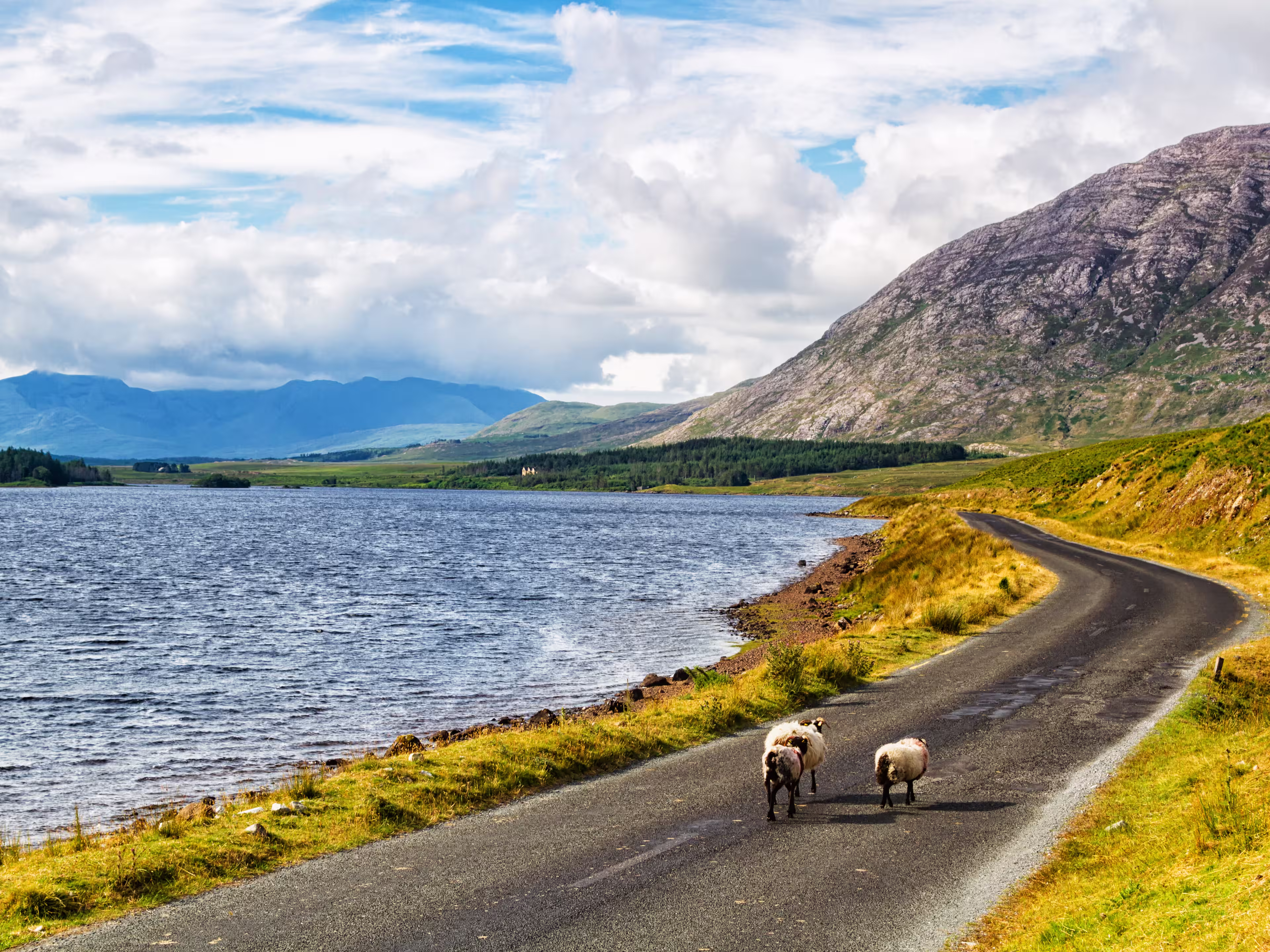 Scenic Inagh Valley during long days of Irish summer. Beautiful landscape of surrounding mountains called Twelve Bens