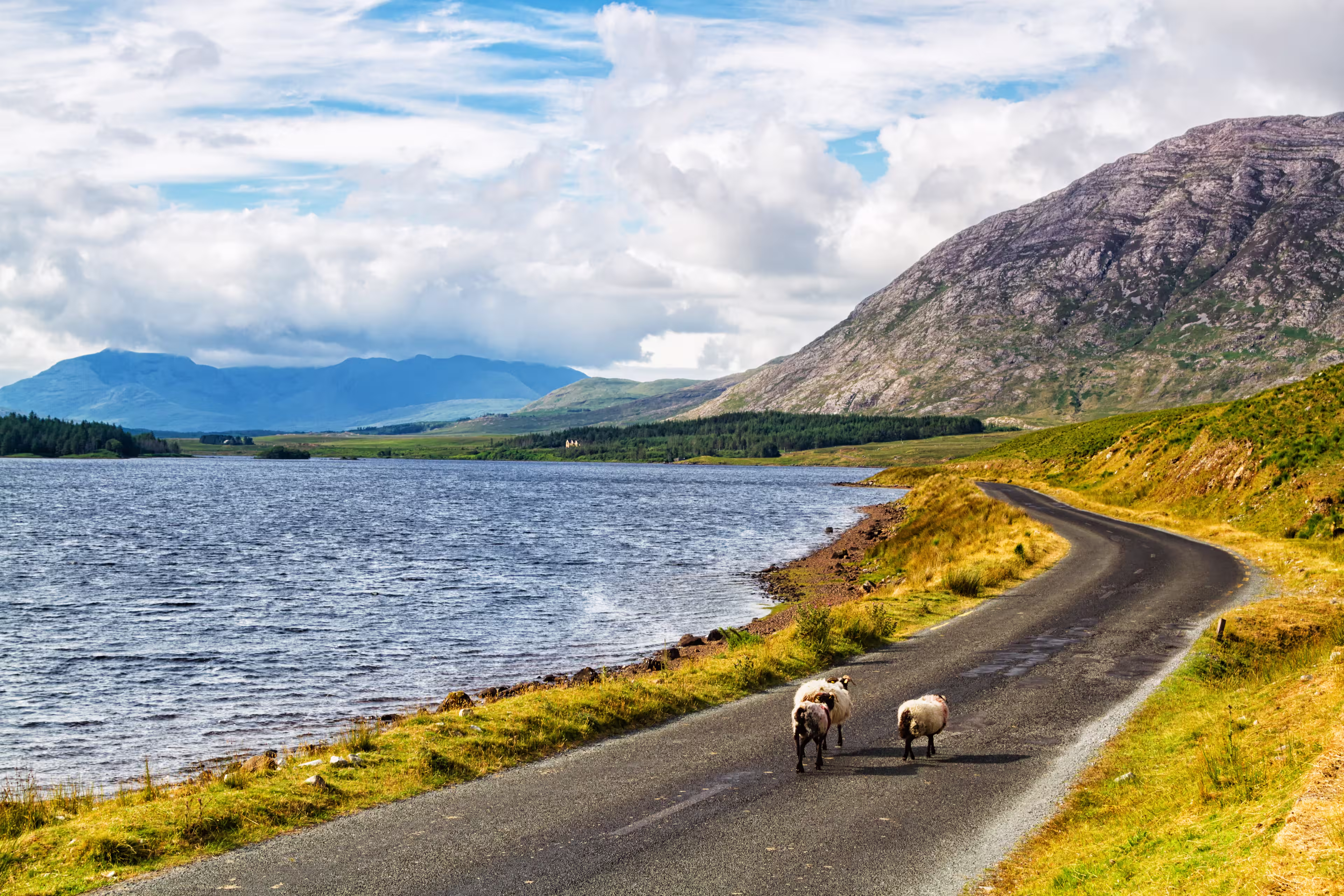 Scenic Inagh Valley during long days of Irish summer. Beautiful landscape of surrounding mountains called Twelve Bens