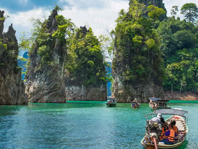 Travellers cruising through Khao Sok by boat