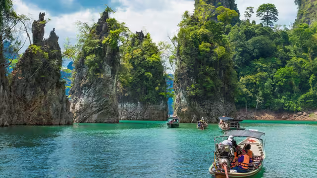 Travellers cruising through Khao Sok by boat
