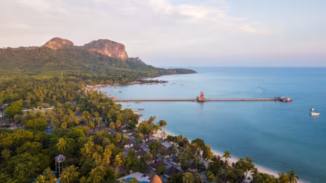 aerial view of koh mook with Pier.It is a small idyllic island in the Andaman Sea in the south of Thailand. Much of the island consists of deep jungle and intact nature