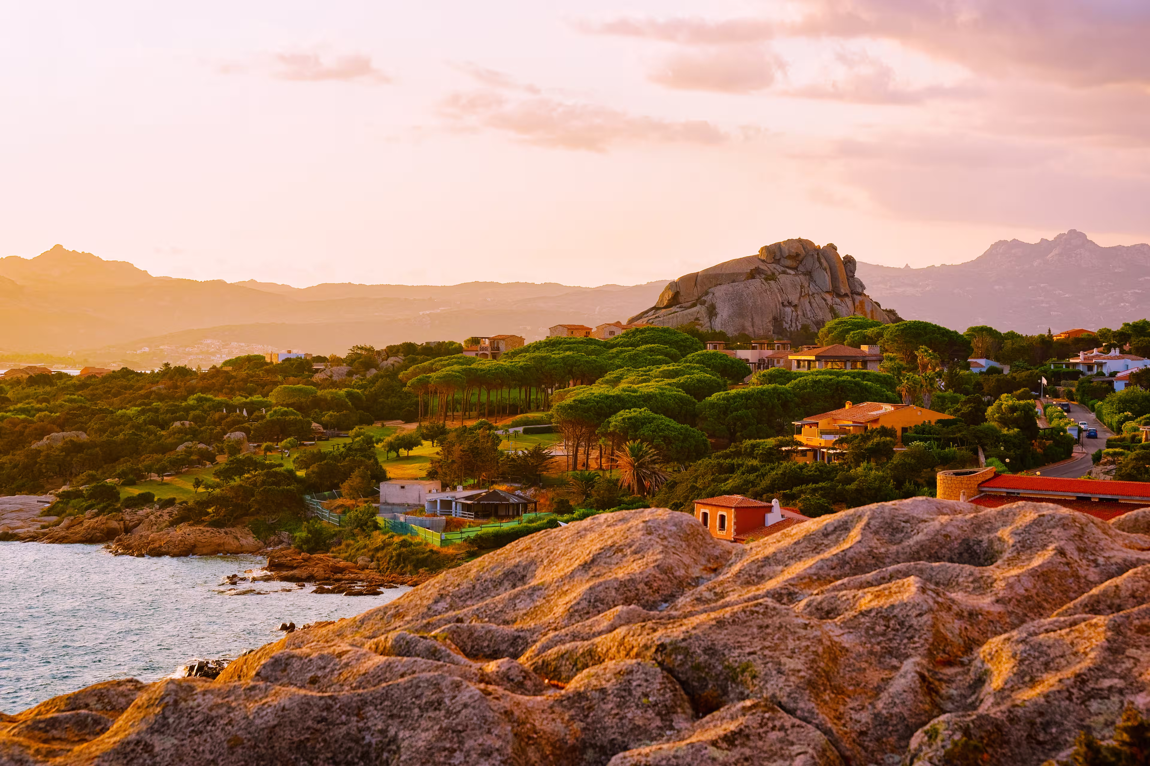 Landscape and scenery of Baja Sardinia luxury resort in Costa Smeralda at sunset evening, Sardegna island in Italy in summer. Olbia province. Villas And Mediterranean sea. Mixed media.