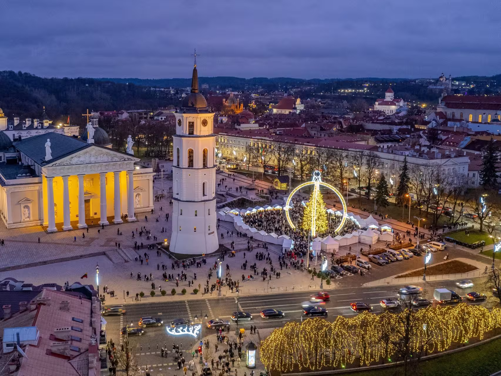Cathedral Square Christmas Markets in Vilnius abound with light, stalls, and happy locals