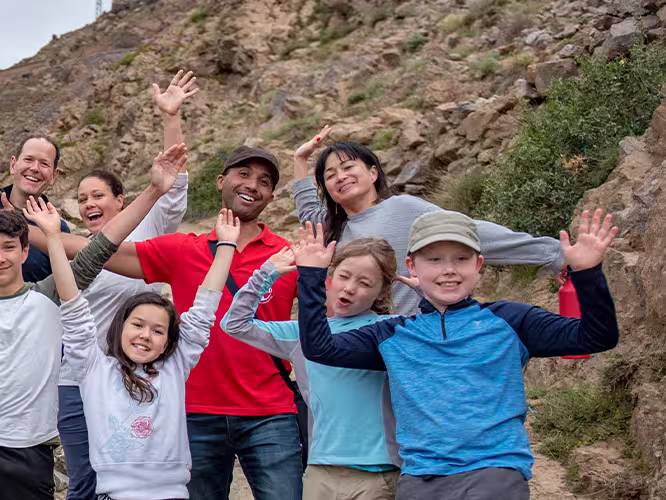 Family posing with local leader in the Atlas Mountains region of Morocco