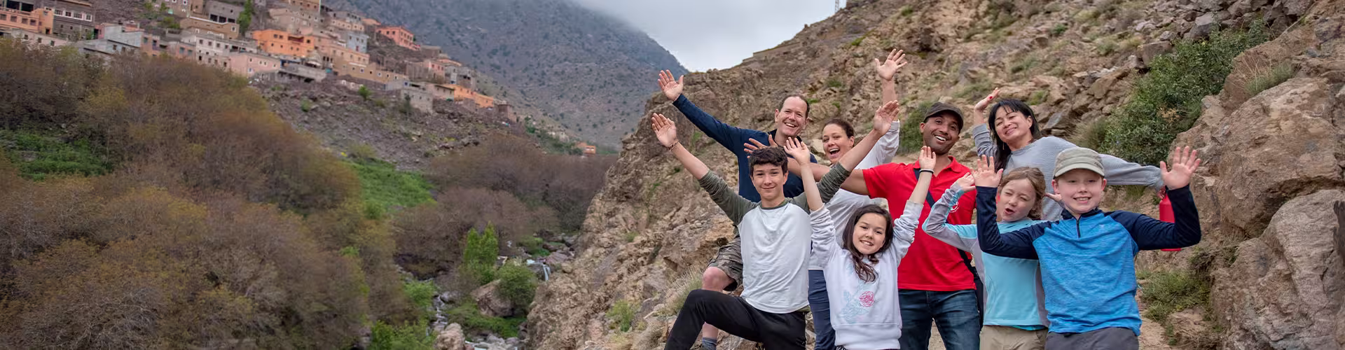 Family posing with local leader in the Atlas Mountains region of Morocco