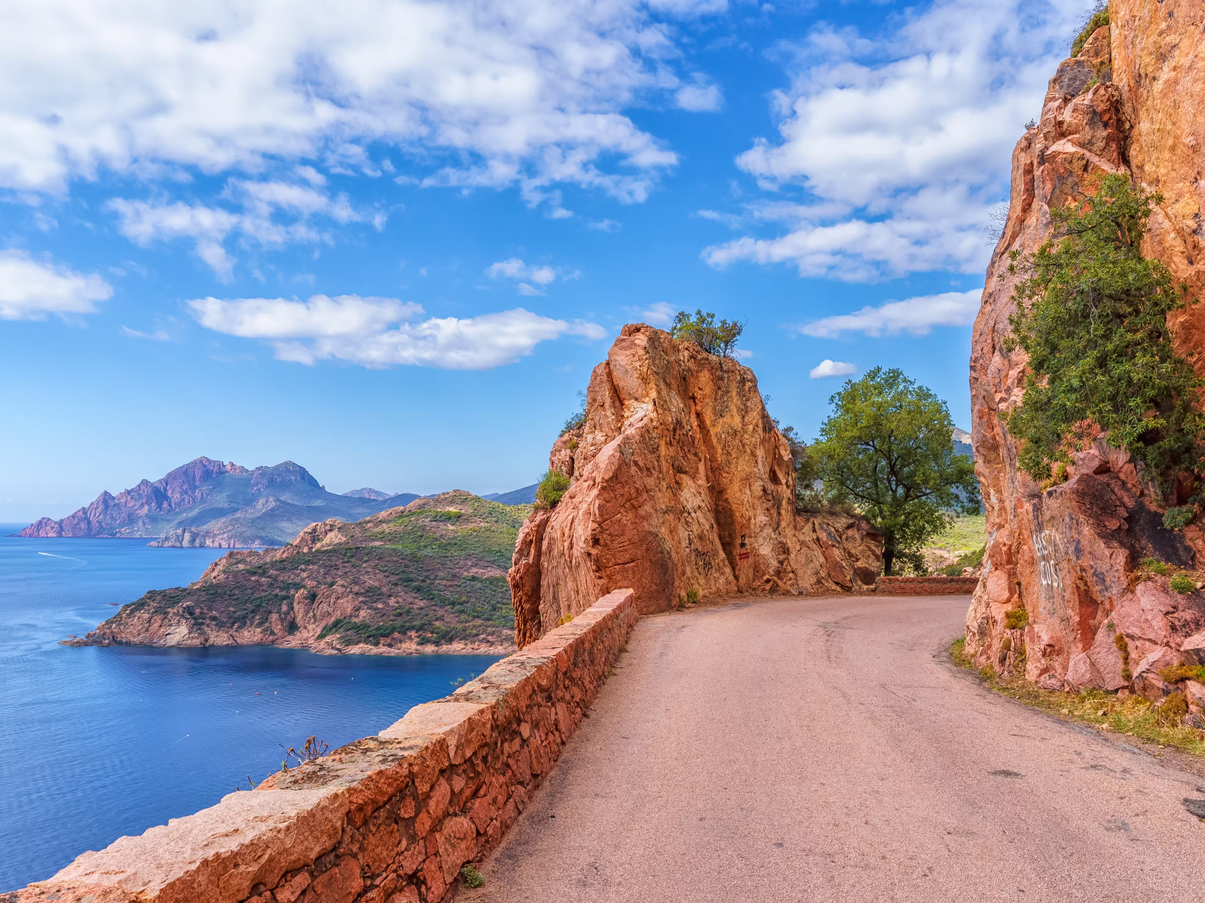 Landscape with mountain road in Calanques de Piana, Corsica island, France