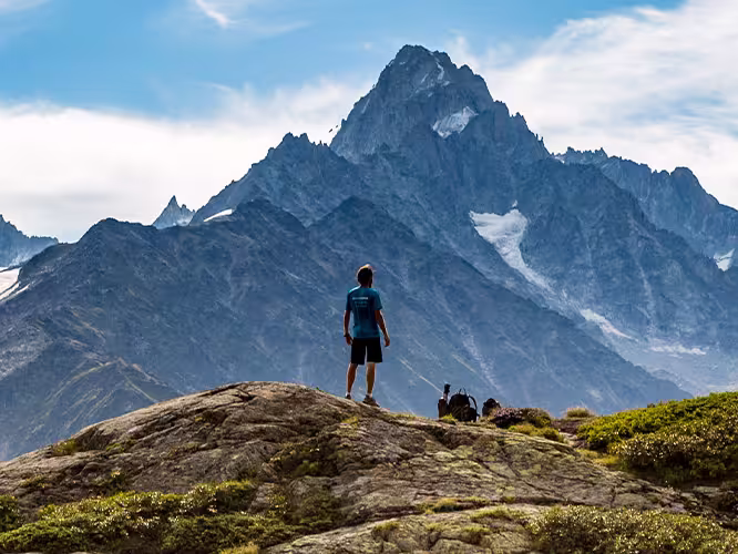 Hiker admiring Mont Blanc mountain range, France