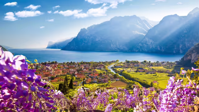 Town of Torbole and Lago di Garda sunset view, Trentino Alto Adige region of Italy