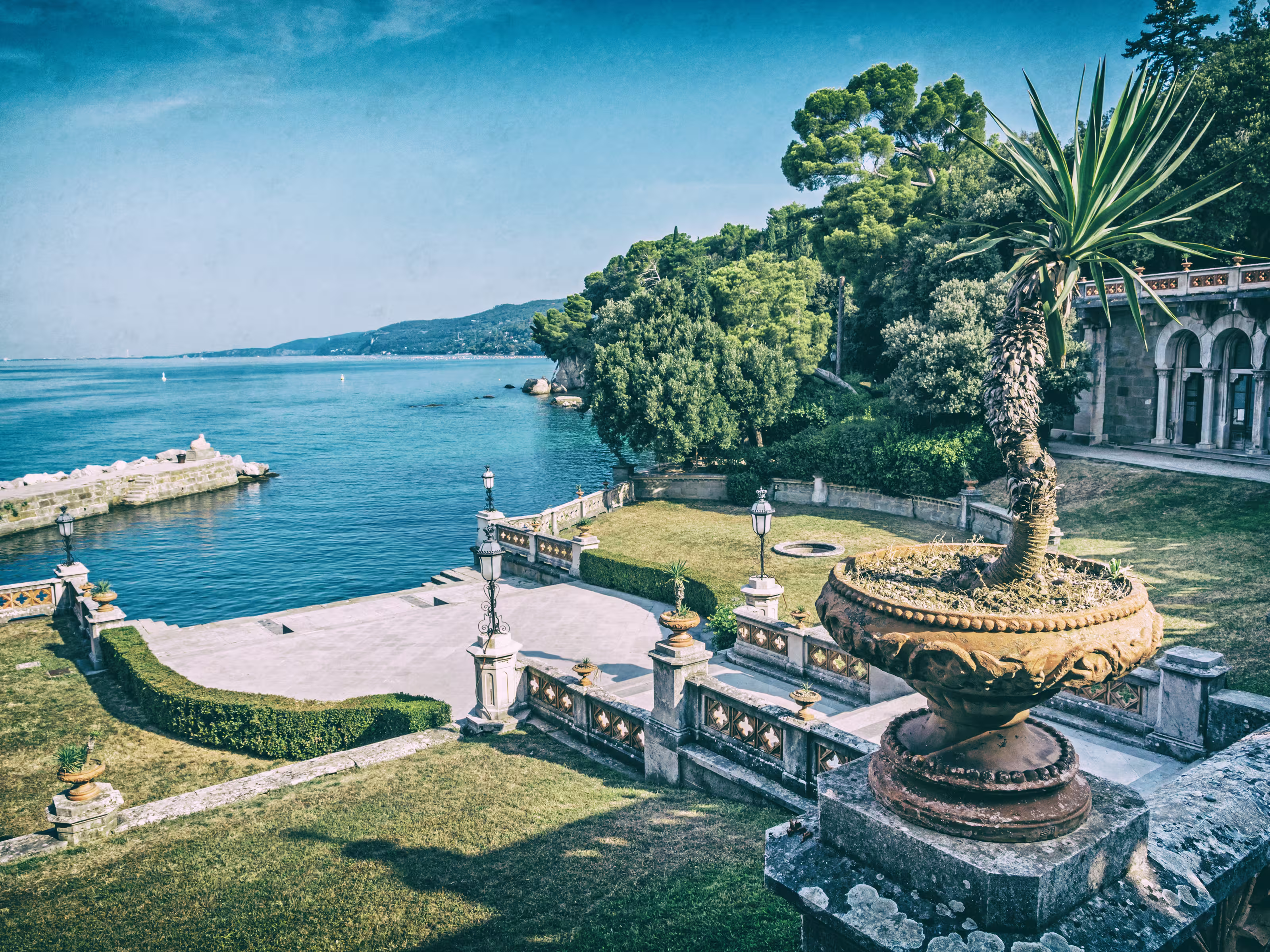 View from Miramare Castle near Trieste, northeastern Italy. Travel destination. Analog photo filter with scratches.