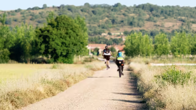 Way of St James , Camino de Santiago , pilgrims cycling to Compostela , Leon, Spain