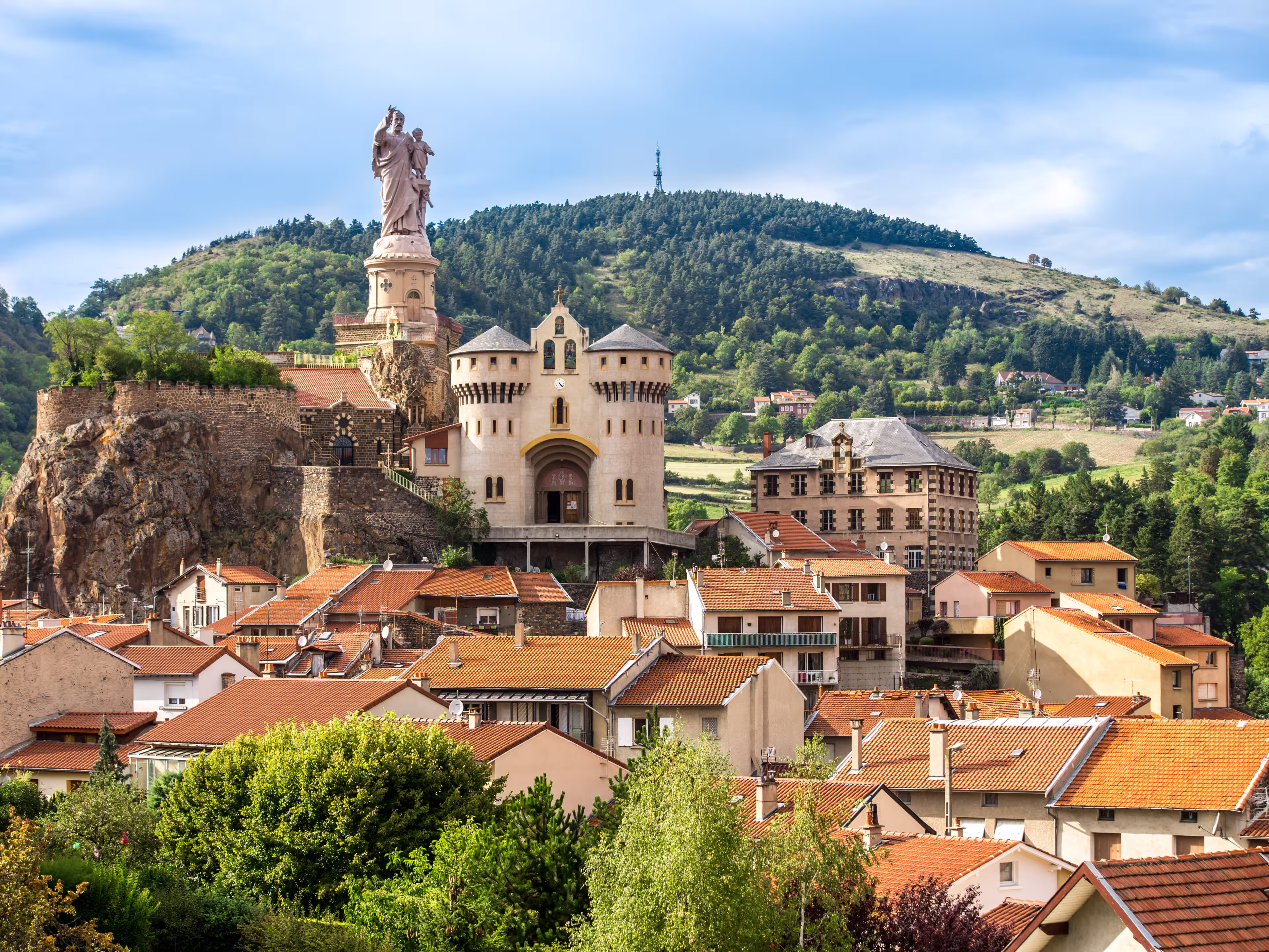 Ancient Chapel Saint Michel de Aiguilhe standing at a very steep volcanic needle .Le Puy en Velay, France.
