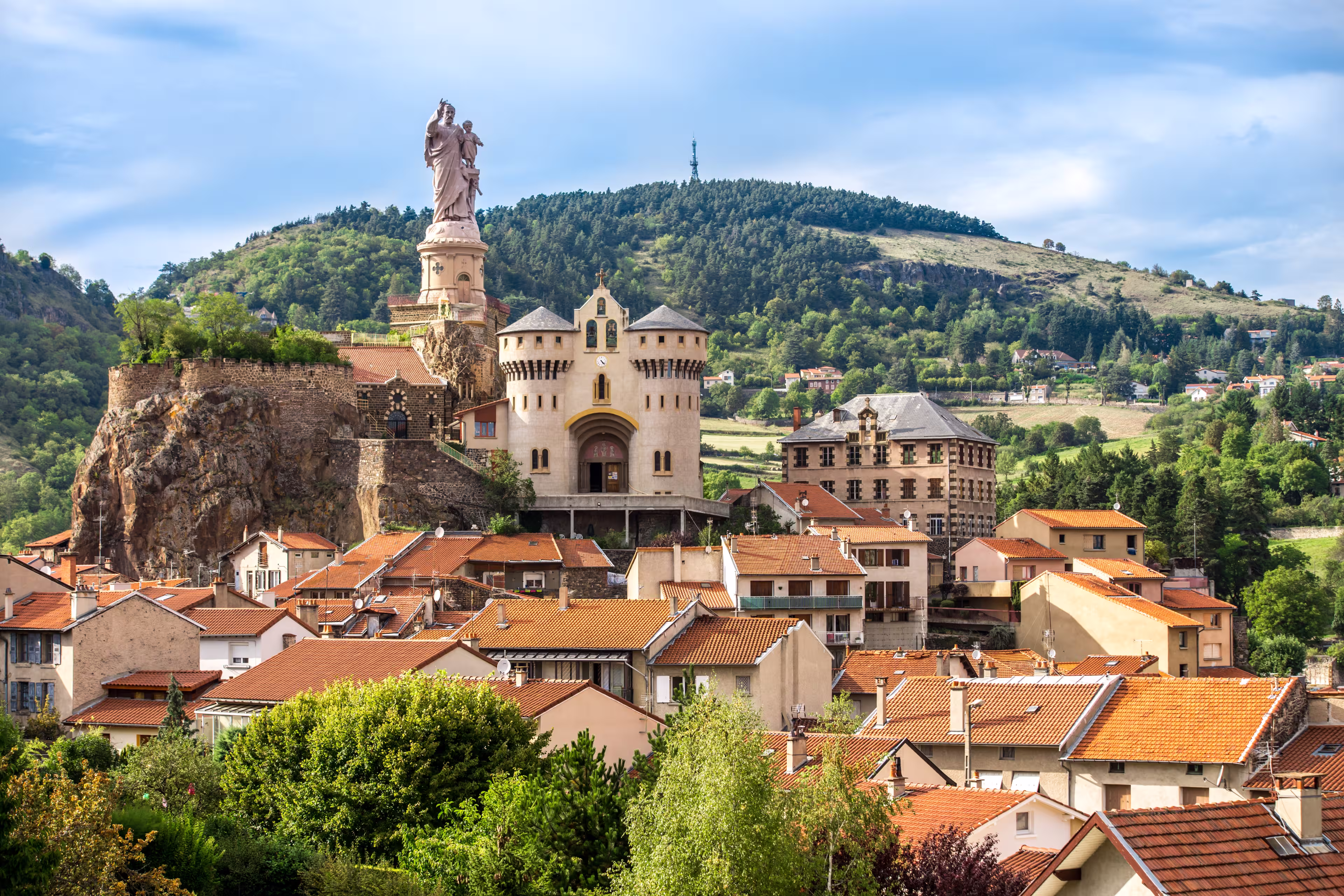 Ancient Chapel Saint Michel de Aiguilhe standing at a very steep volcanic needle .Le Puy en Velay, France.