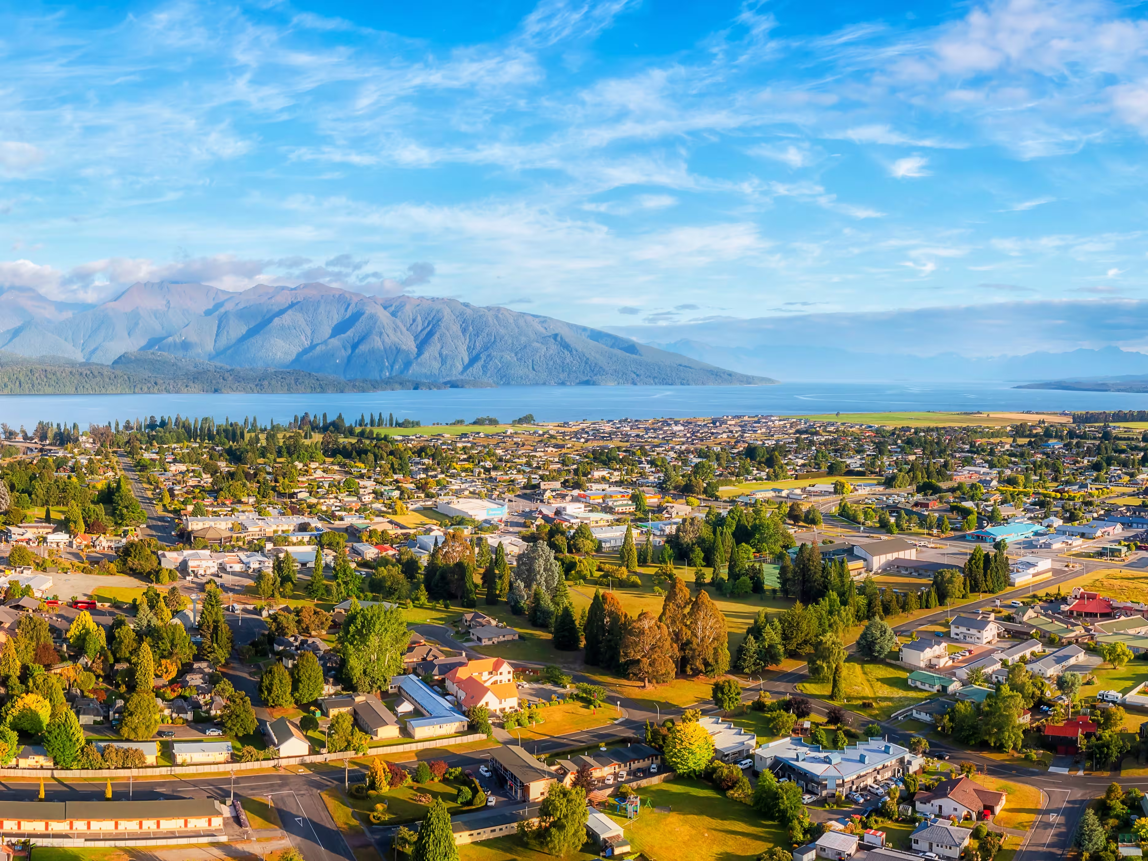 Lake Te Anau and Te Anau town in Fiordland of New Zealand - scenic aerial panorama of Gateway to Milford Sound.