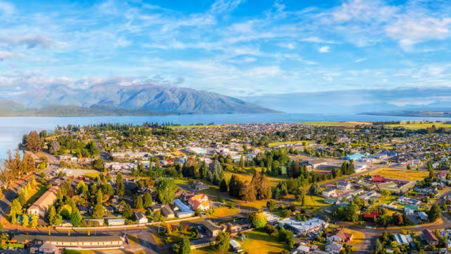 Lake Te Anau and Te Anau town in Fiordland of New Zealand - scenic aerial panorama of Gateway to Milford Sound.