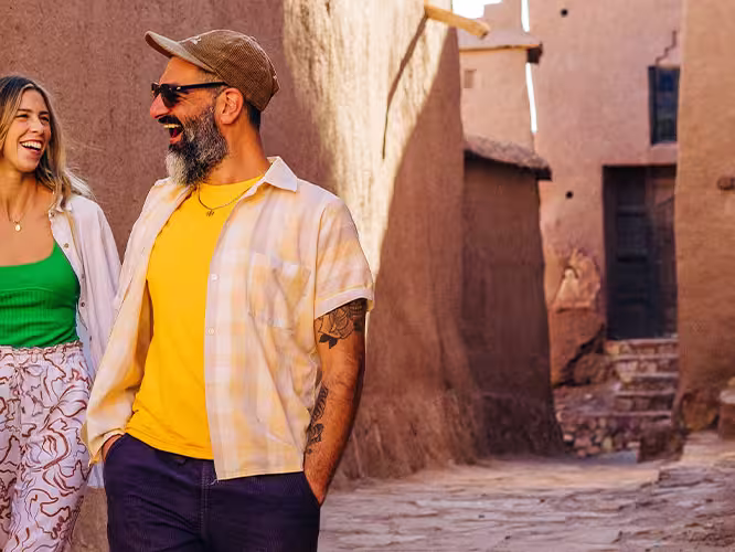 Travellers exploring Ait Benhaddou with local leader in Morocco
