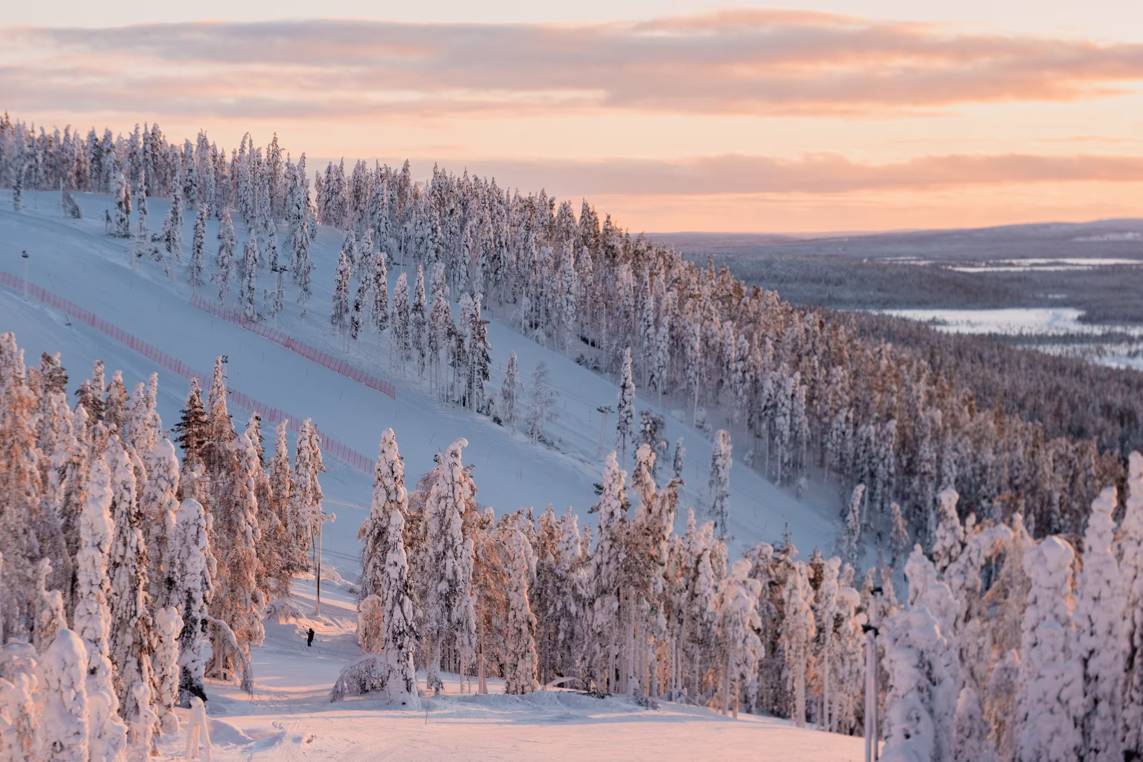 Winter sunrise view of ski slopes and mountains in Levi, Kittilä, Lapland, Finland