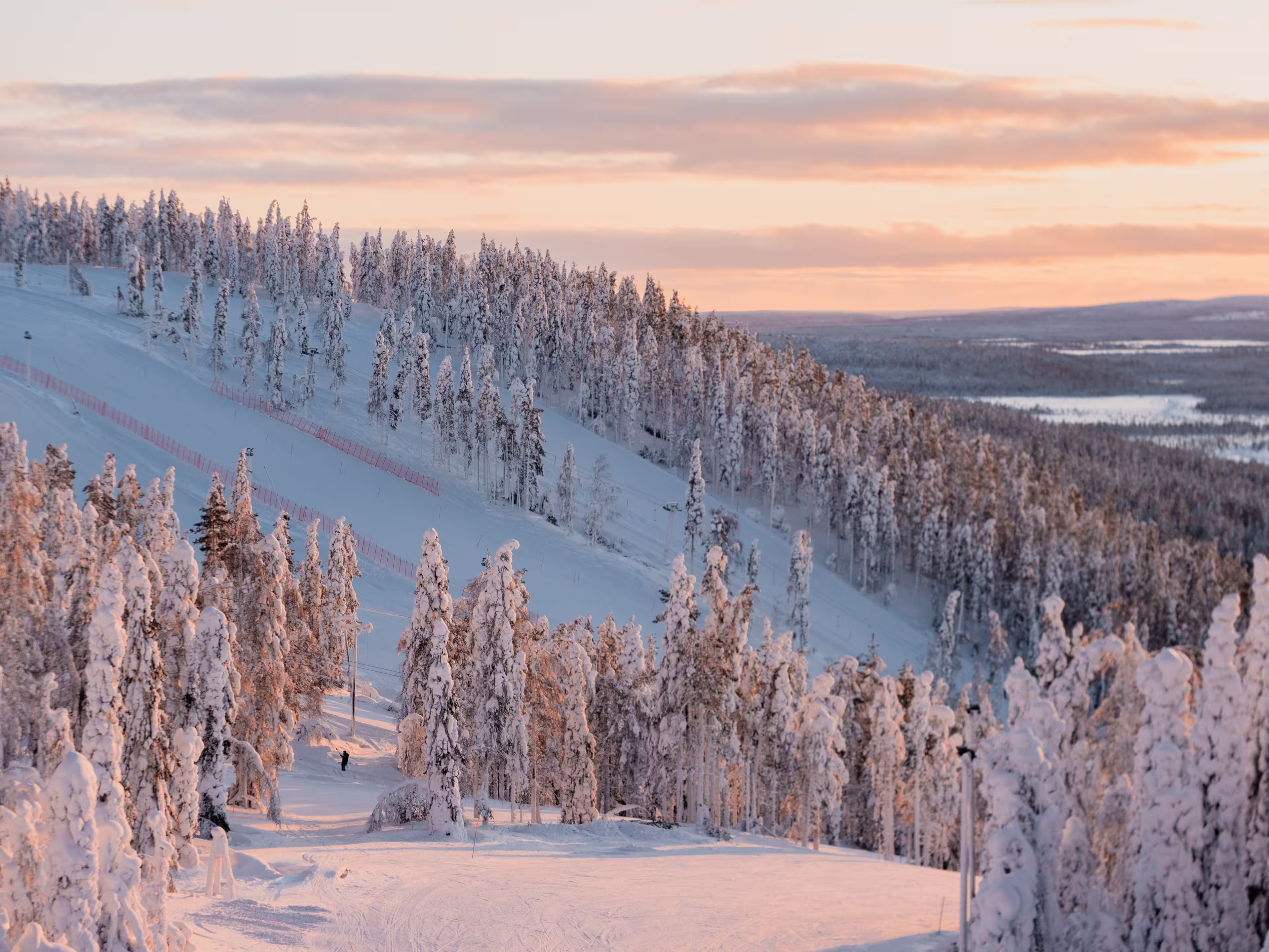 Winter sunrise view of ski slopes and mountains in Levi, Kittilä, Lapland, Finland