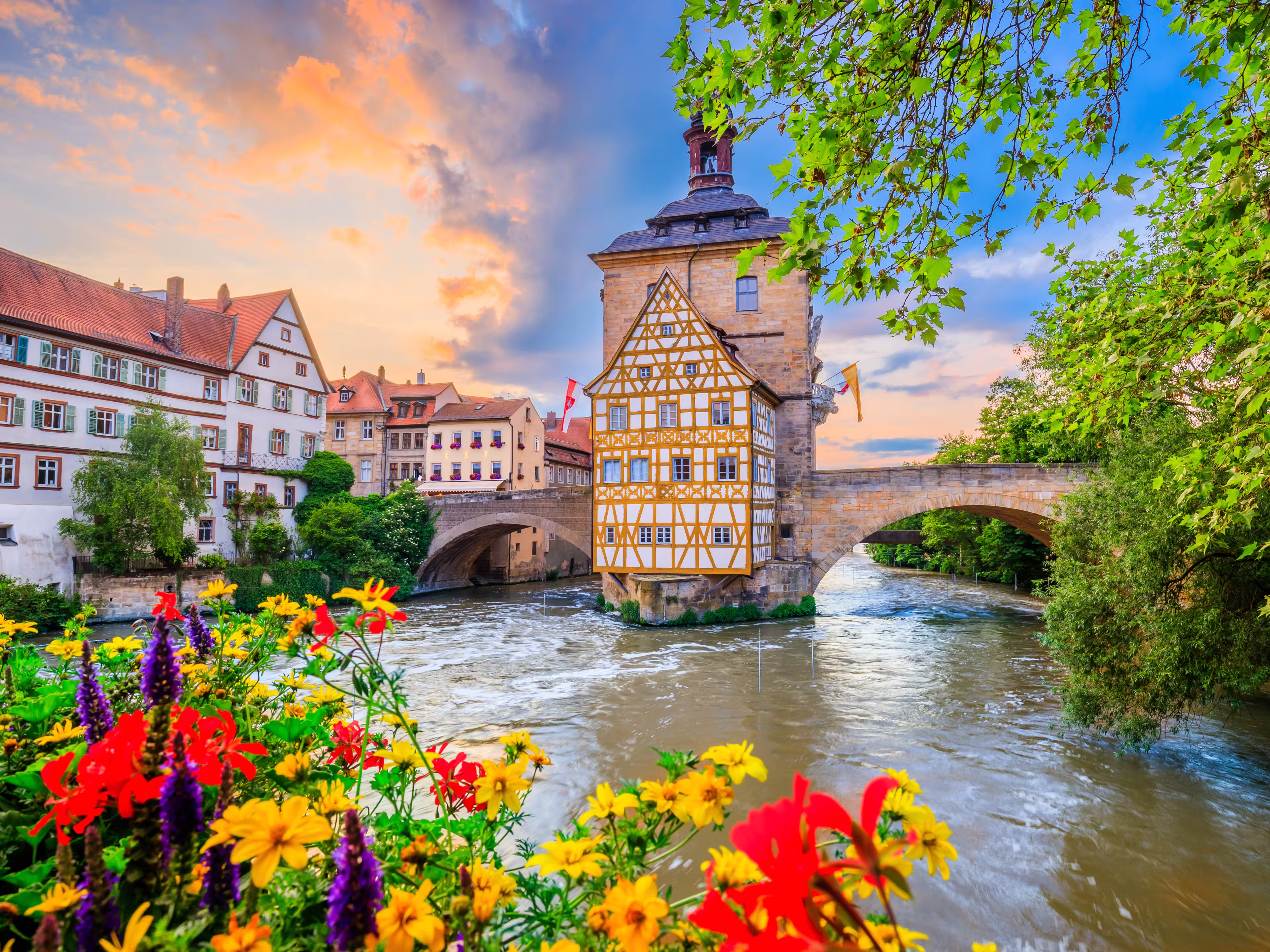 Bamberg, Germany. Town Hall of Bamberg (Altes Rathaus) with two bridges over the Regnitz river. Upper Franconia, Bavaria.