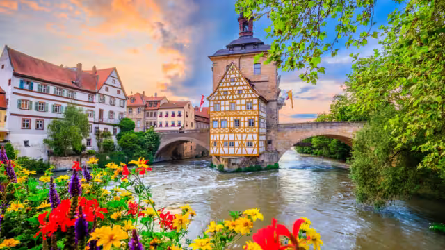Bamberg, Germany. Town Hall of Bamberg (Altes Rathaus) with two bridges over the Regnitz river. Upper Franconia, Bavaria.